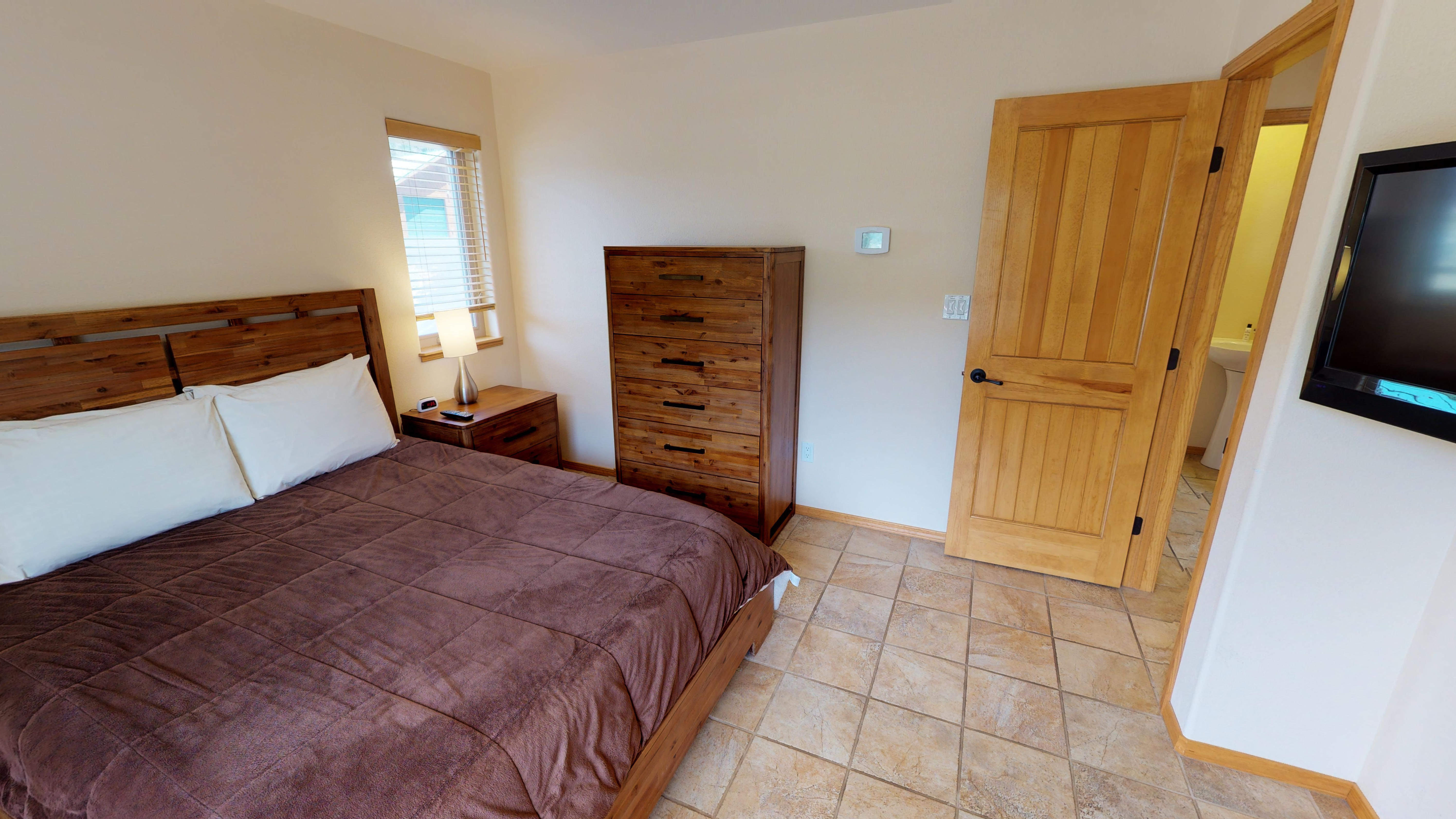 Master bedroom with a very comfortable king-size bed
