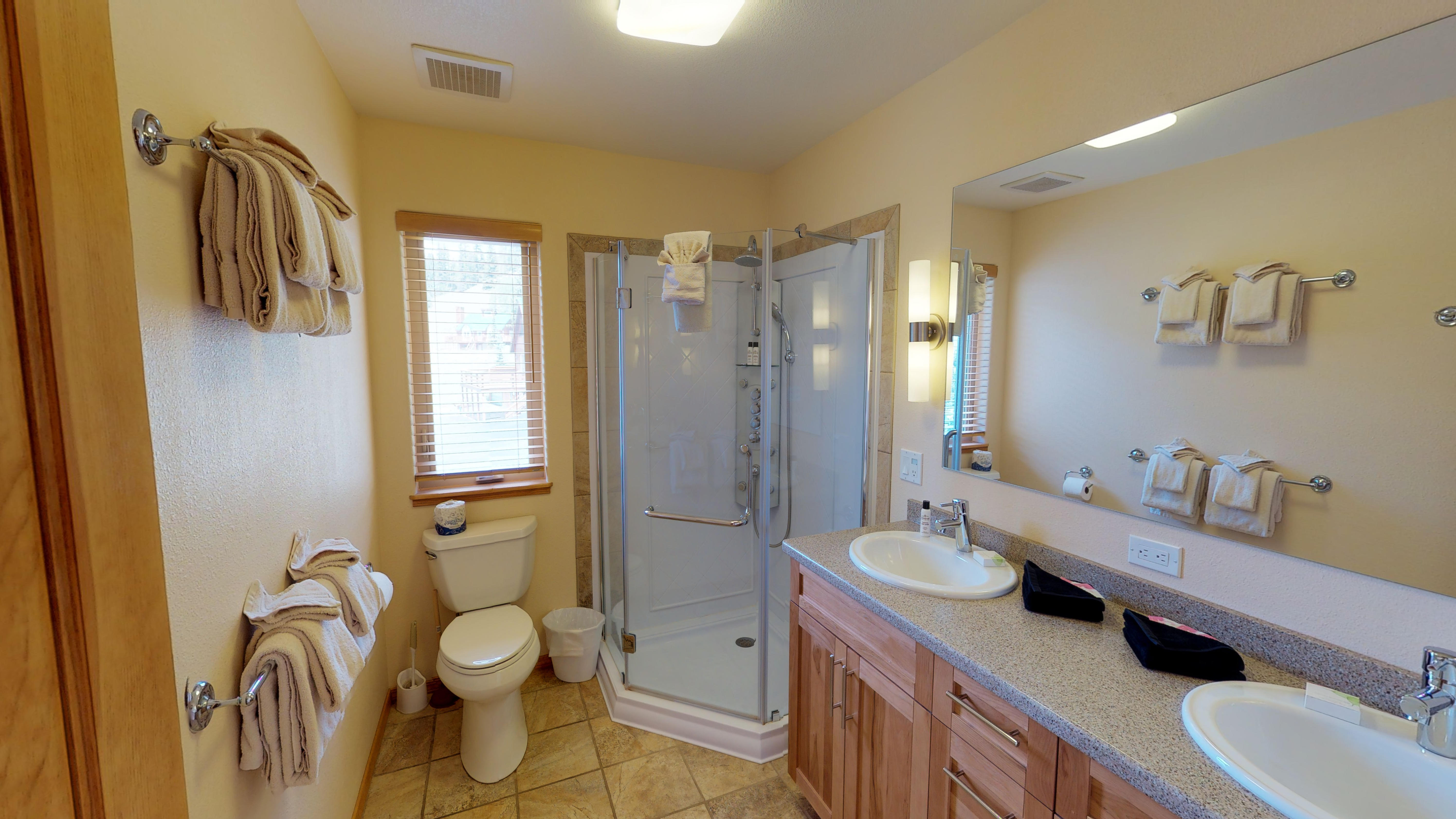 Second bathroom, complete with dual sinks, and a state-of-the-art jetted shower. You'll feel like you're in your own private spa!