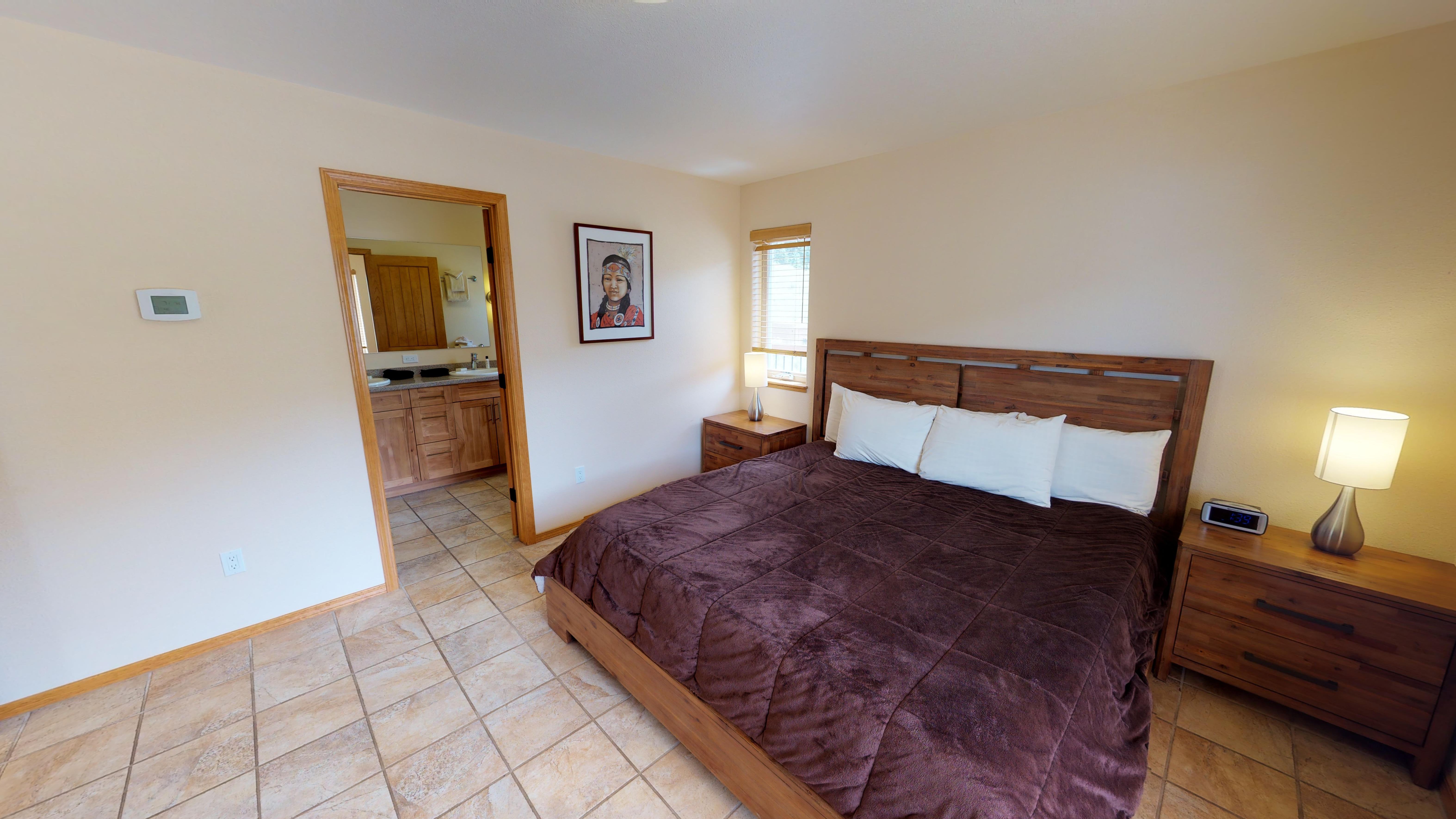 King-size bed and master bathroom 