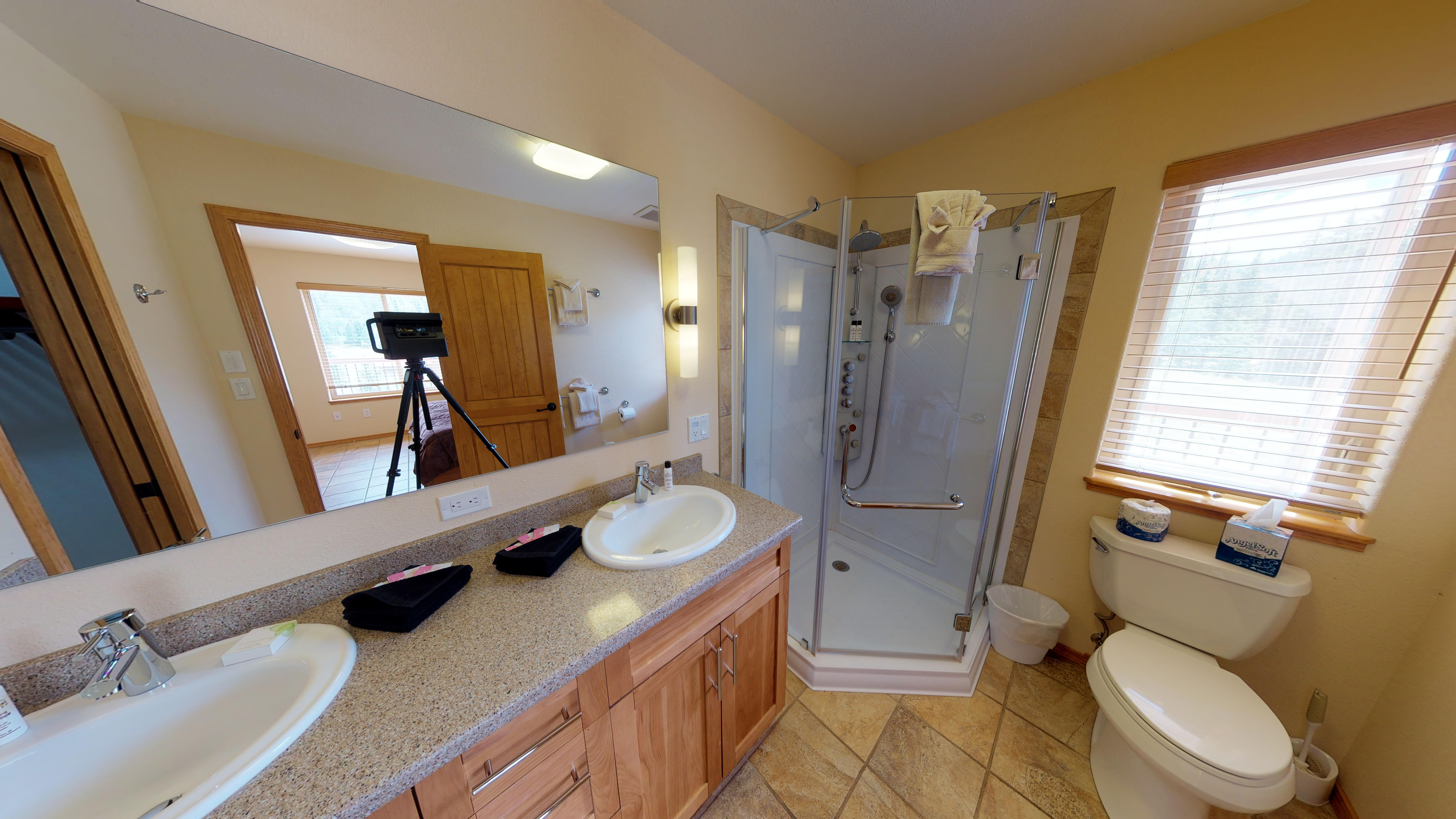 Master bathroom, complete with dual sinks, and a state-of-the-art jetted shower. Your own personal spa!