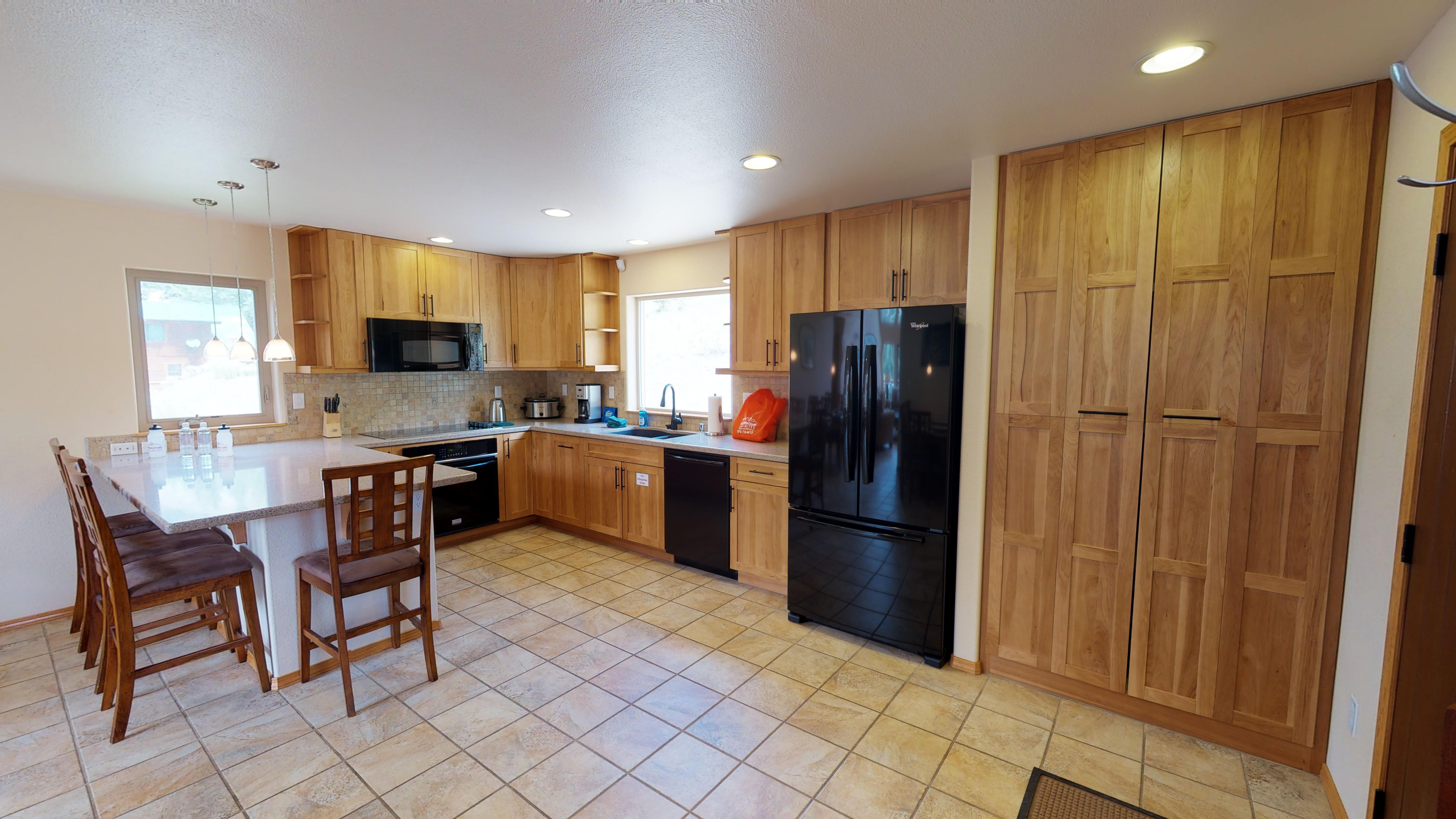 Kitchen with dining area, along with plenty of pantry space
