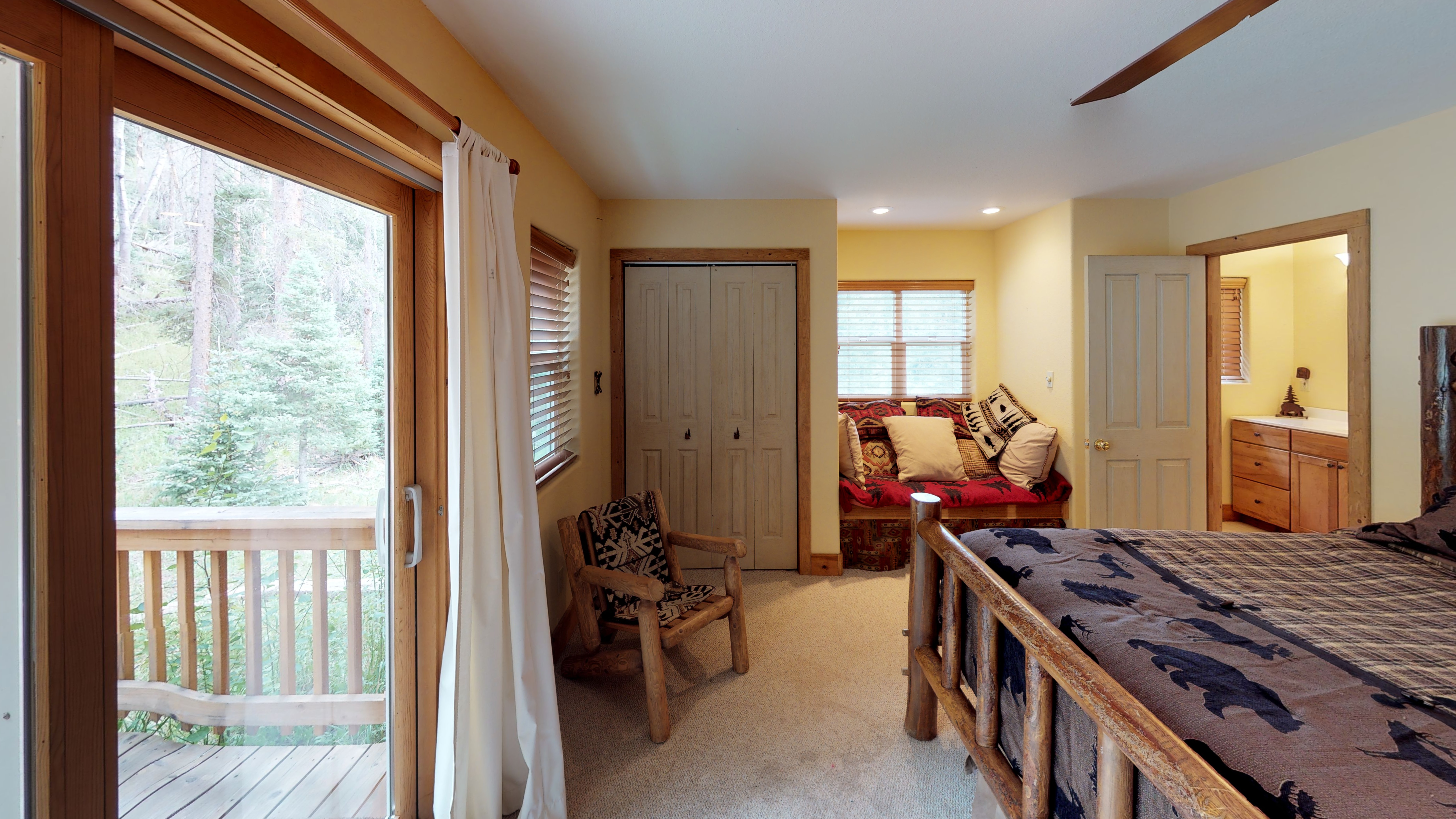 Bedroom with seating area and bathroom