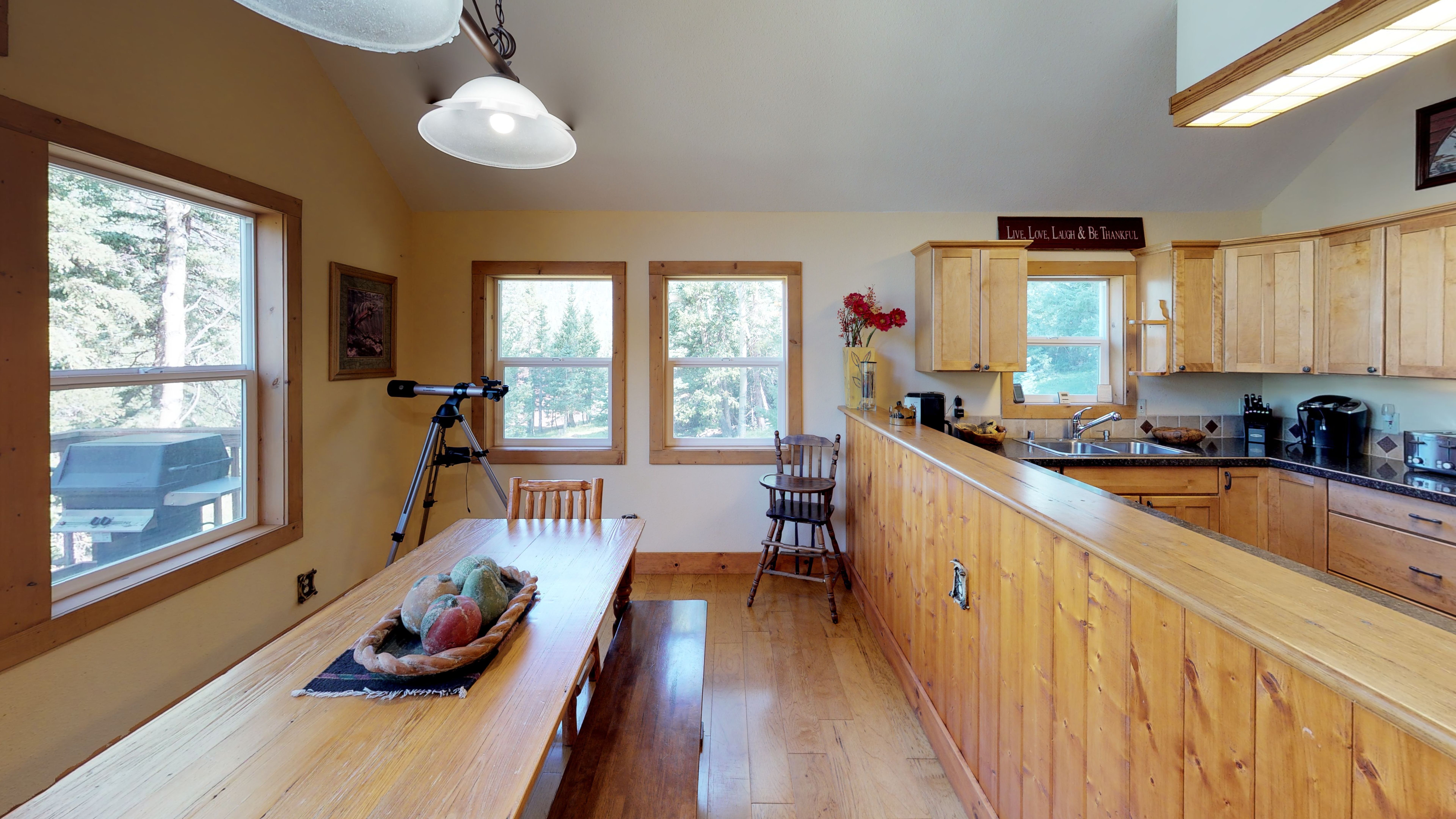 Dining table with plenty of seating right next to the kitchen