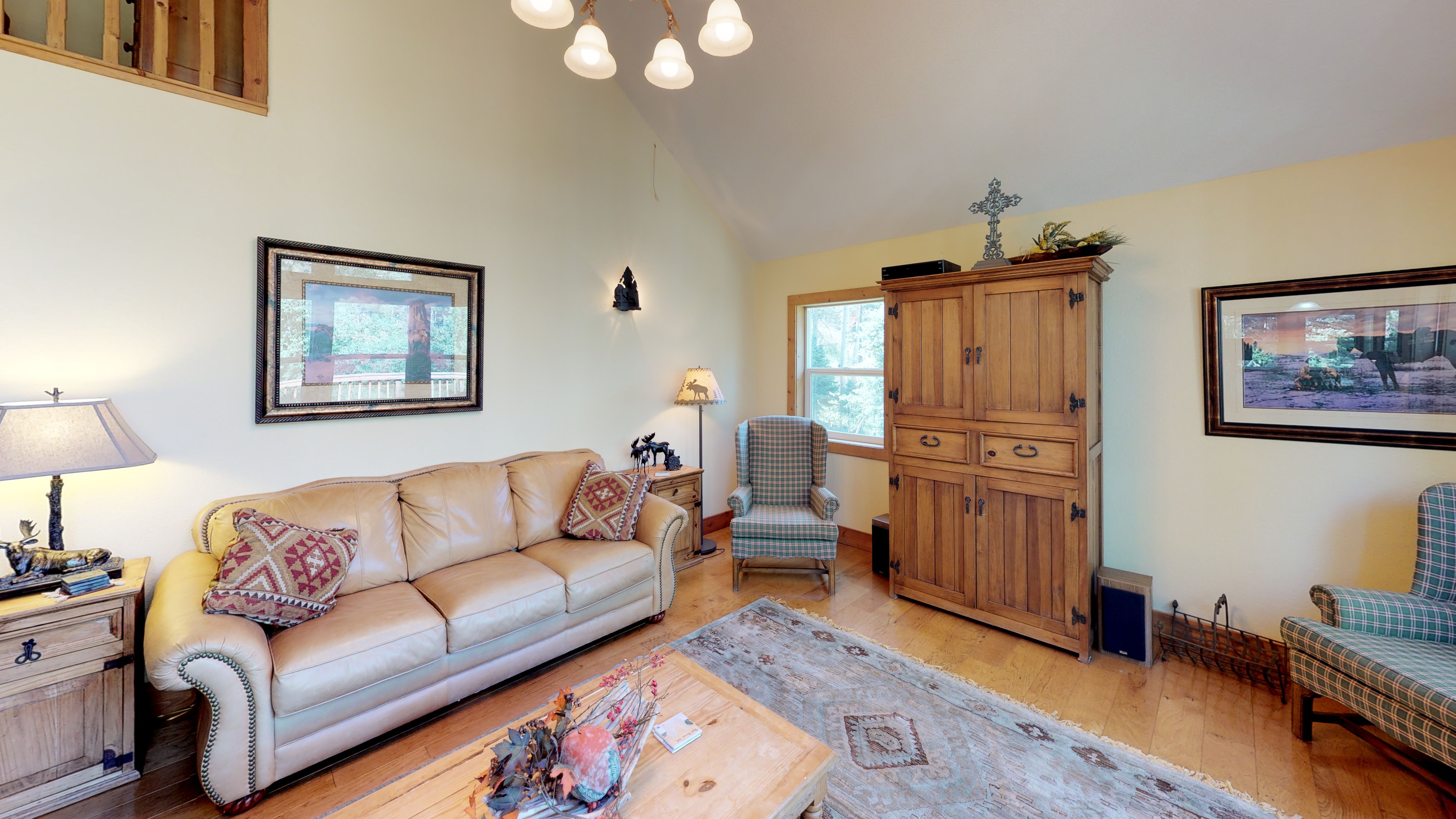 Comfy couches and entertainment center in living room