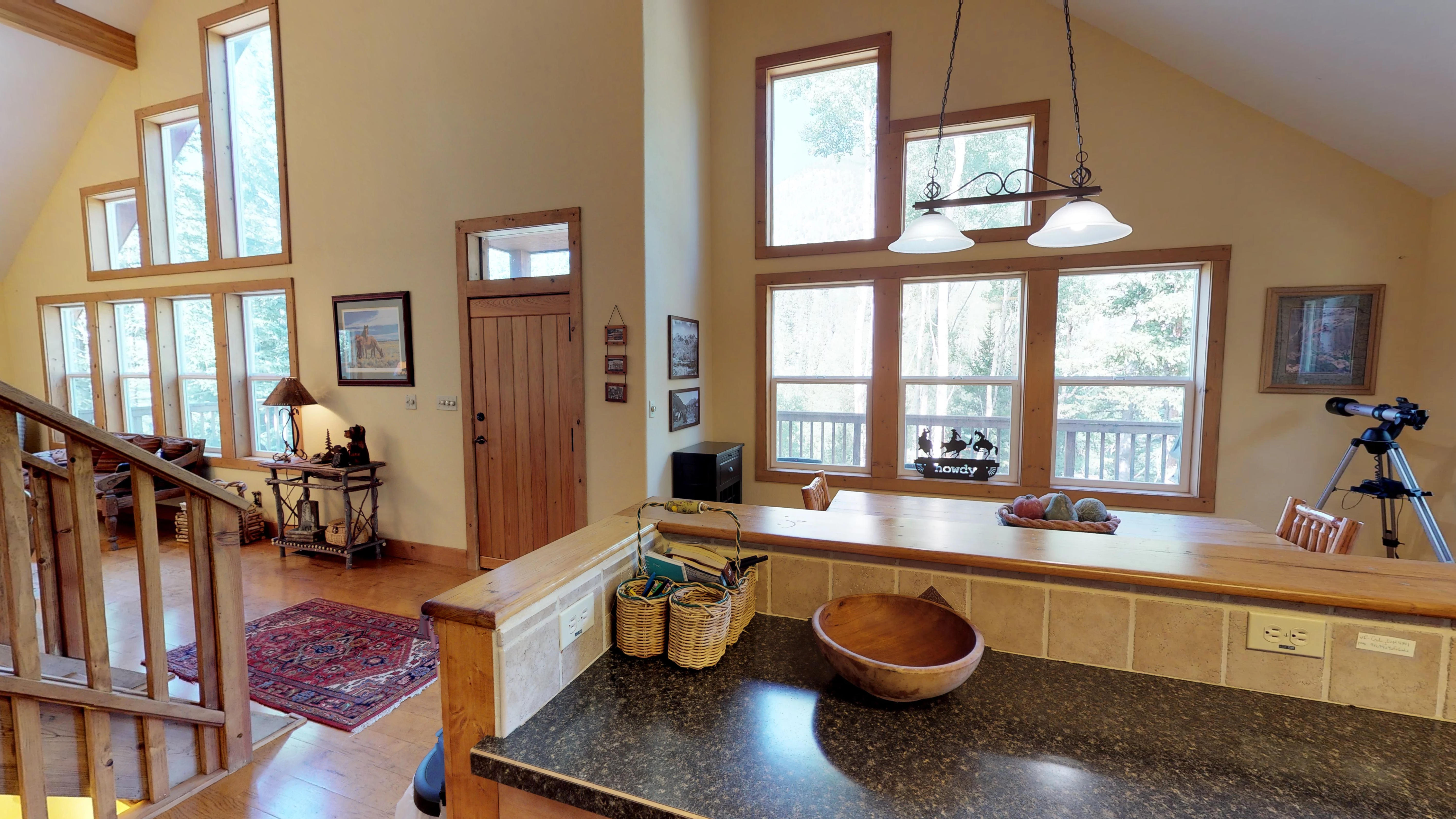 View of kitchen and dining area leading into the living room