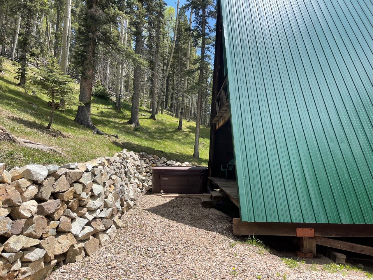 Back of A-Frame with hot tub.